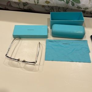 Eyeglass frame bought for $368. Case, box, and lens cleaner cloth are included.